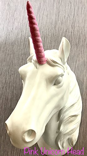 Wall mounted unicorn head white with a pink horn. Wall decor. Interior statement piece. Children's bedroom.