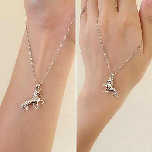 Unicorn necklace on model wrist