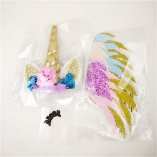 Unicorn cake topper with pink flower, gold horn and glittery wings
