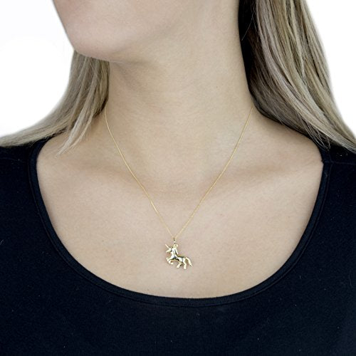 Gold unicorn necklace worn by model