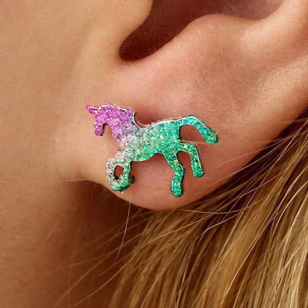 Model wearing the unicorn earrings